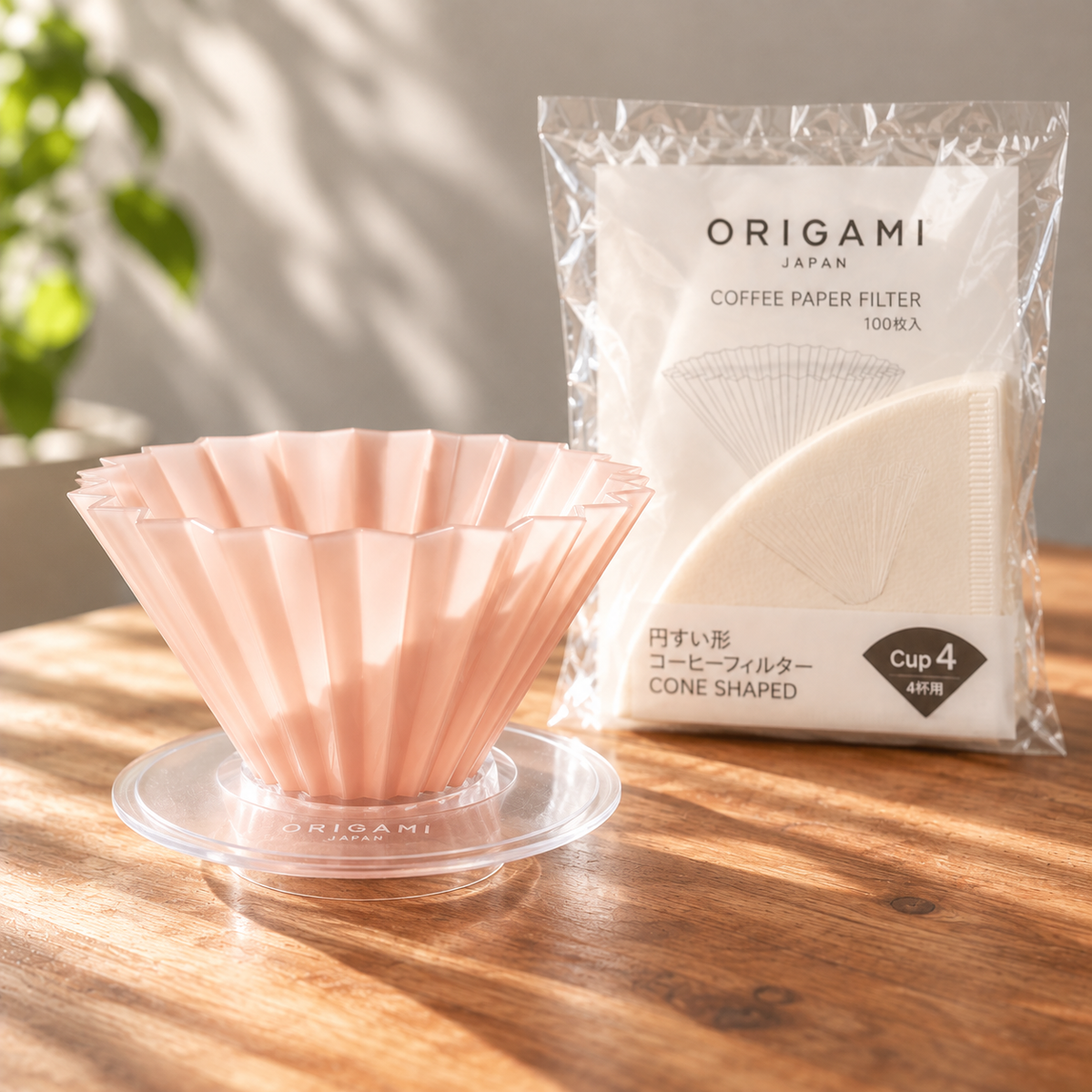 Origami Air M Dripper rosa im AS Holder und dahinter Filterpackung